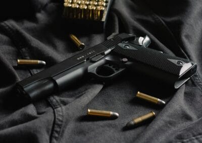 black semi automatic pistol on black textile